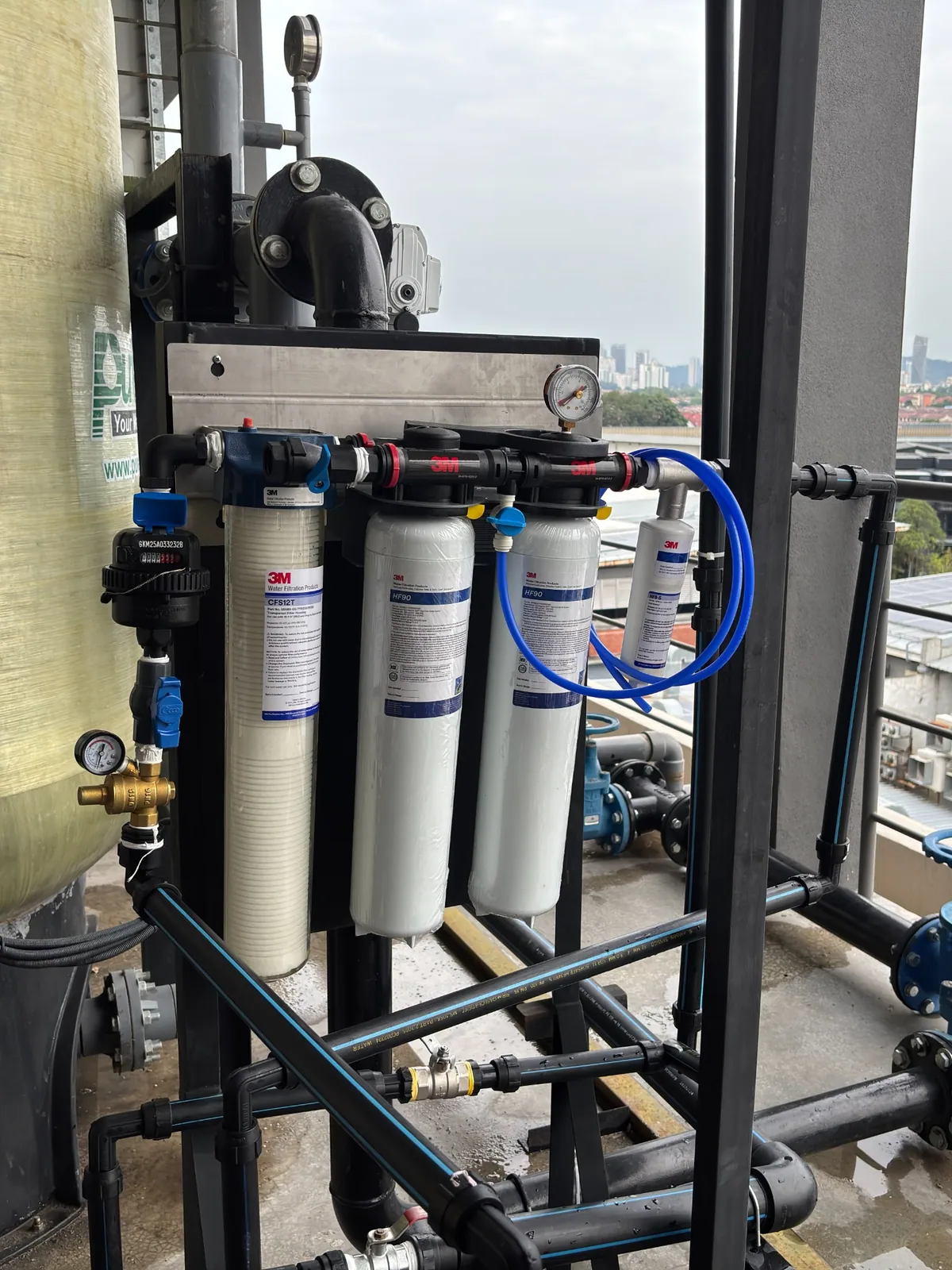 Multi-stage water filtration system in a commercial installation setting